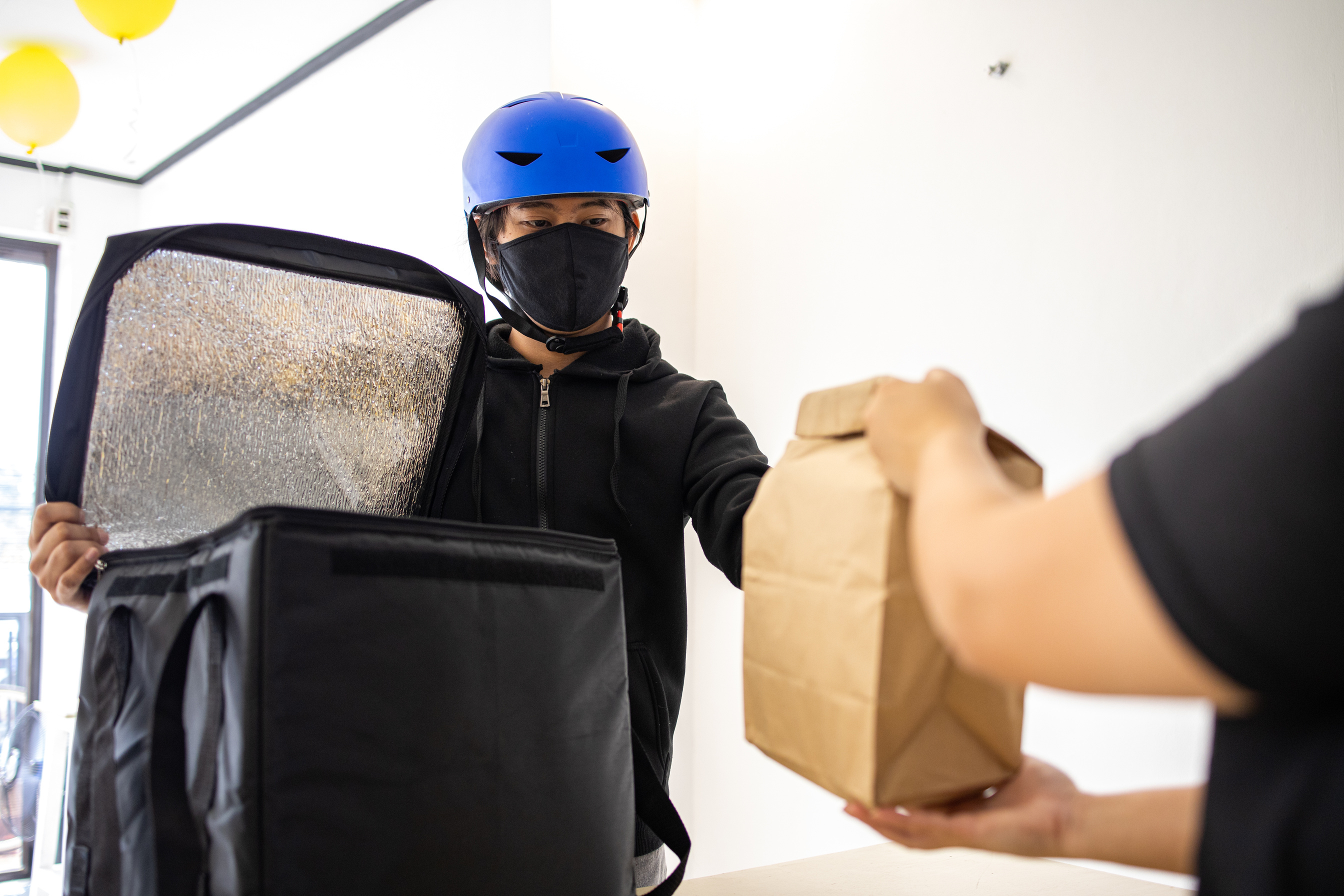 Deliveryman in Face Mask Receiving his Order